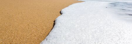 Tropical beach with panoramic views and waves, rocks and sand background. Travel destinations in...