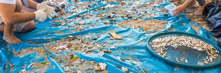 Beach Cleaning in panoramic view. Cleaning dirty beaches by the action of man. Sustainability of the...