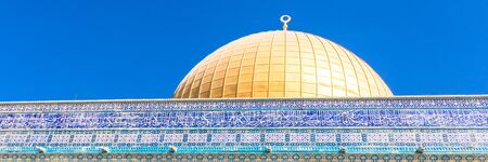 The Dome of the Rock on the temple mount in Jerusalem - Israel. Web banner in panoramic view.