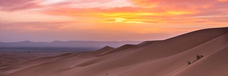 Merzouga in the Sahara Desert in Morocco. Afica. Web banner in panoramic view.の写真素材