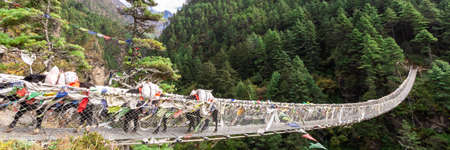 Suspention bridge on the Everest Base Camp Trek, Himalaya mountains, Sagarmatha National Park,...
