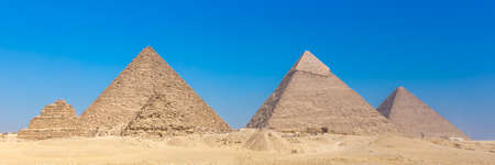 The pyramids at Giza in Egypt. Web banner in panoramic view. Africa.