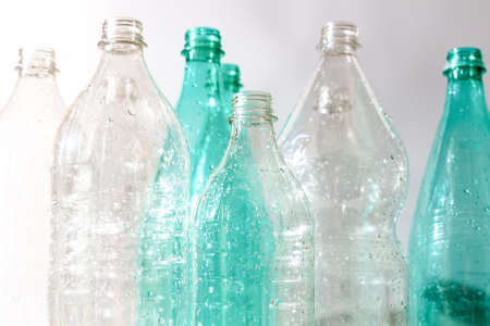 several empty plastic bottles with water drops. ecology, recyclingの写真素材