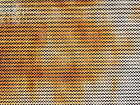 Abstract grunge rusty perforated steel sheet textured backgroundの写真素材