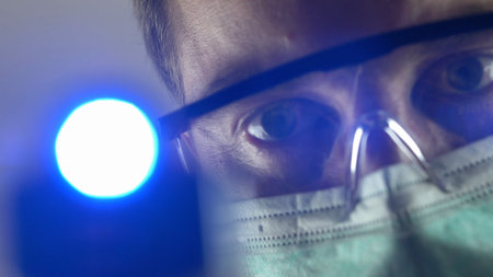 Doctor in Surgical Mask Using Non-Contact Thermometer on Patient POV