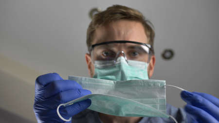 Doctor Putting Surgical Mask  Patient's Face POV