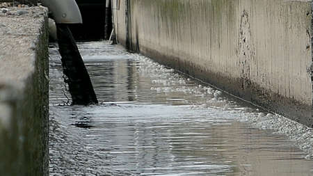 Sewage Farm Waste Water Flowing From Pipeの写真素材