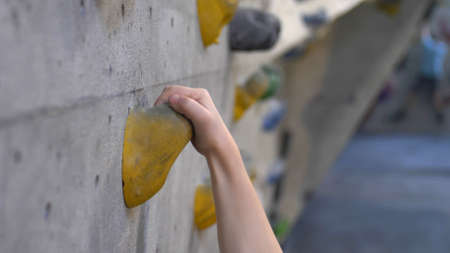 Young Caucasian Girl Climbing Indoor Climbing Wall Close Up