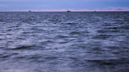 Time lapse ships on sea horizon long exposure