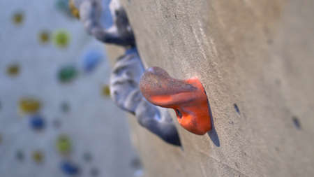 Young Caucasian Girl Climbing Indoor Climbing Wall Close Upの写真素材