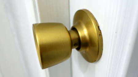 Opening and Closing Door by Gold Door-Knobの写真素材