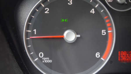 Tachometer Gauge of Starting and Stopping Car Close Upの写真素材