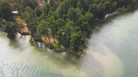 Aerial View of Peninsula on Turquoise Green Water Lakeの写真素材