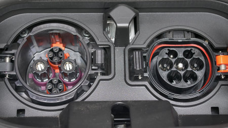Electric Vehicle Charging Sockets Type 2 and CHAdeMO Being Opened and Closedの写真素材