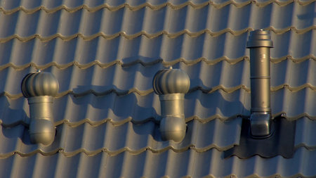 Wind-Rolling Cowl on Chimney Rotating on Windの写真素材