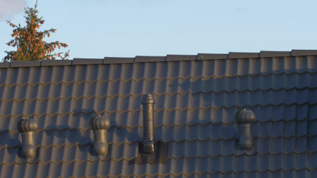 Wind-Rolling Cowl on Chimney Rotating on Windの写真素材