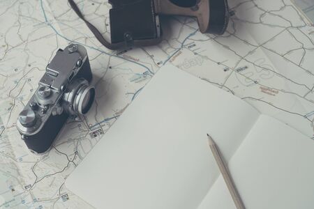 Planning to travel with a camera and a map.の写真素材