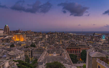Genoa old city at sunset from Spianata Castelletto in Italy.の写真素材