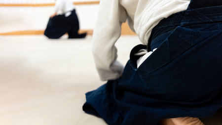 Practicing aikido martial art on a tatami. Greeting gesture.の写真素材