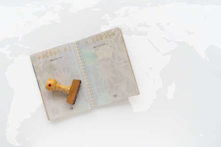 Italian passport pages with a lot of visa stamps on a map.の写真素材