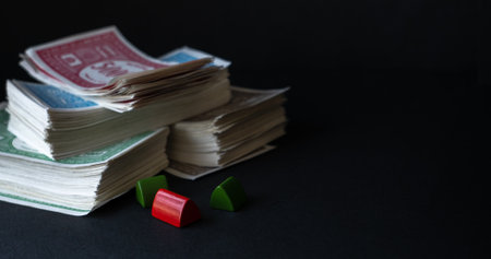 Stack of fake banknotes on black background.の写真素材