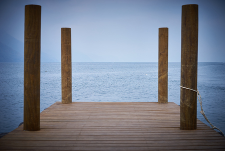 Landing stage at Lake Atitlan in Guatemala / Nebulous horizon over Lake Atitlanの写真素材