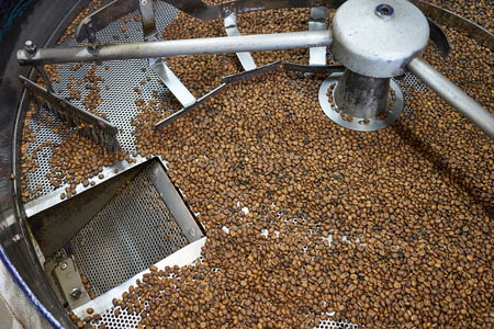 Old coffee cup with coffee beans and coffee beans