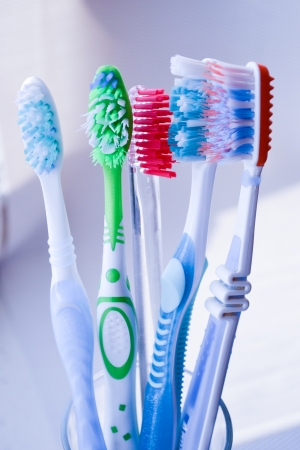 Toothbrushes in glass isolatedの写真素材