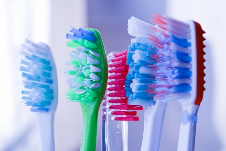 Toothbrushes in glass isolatedの写真素材