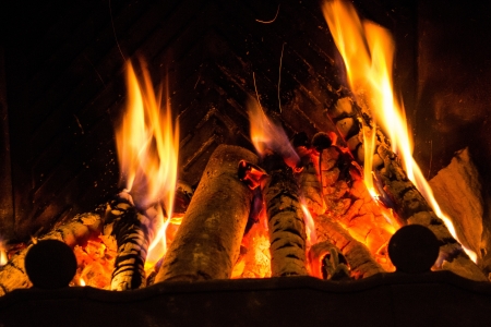 Fire in a fireplace  Fire flames on a black backgroundの写真素材