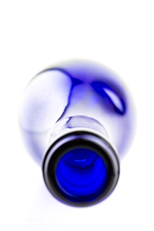 Wine in blue bottle isolated on white backgroundの写真素材