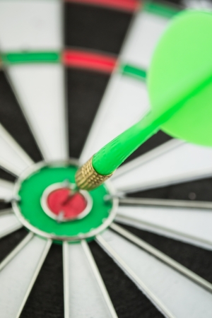 dart hitting a targetの写真素材