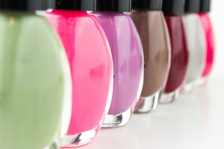 Group of bright nail polishes on whiteの写真素材