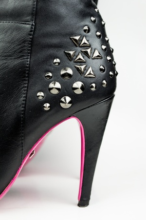 Female high boots with spikes isolated on white の写真素材