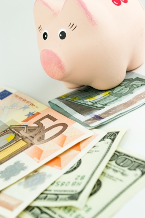 Dollars, Euro and moneyboxの写真素材