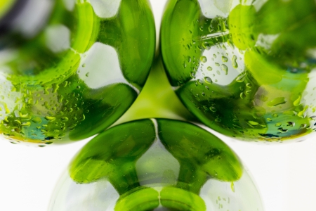  empty green wine bottles isolated on white backgroundの写真素材