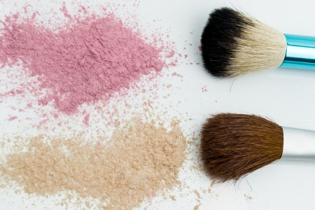 broken eyeshadow palette with brush on white の写真素材