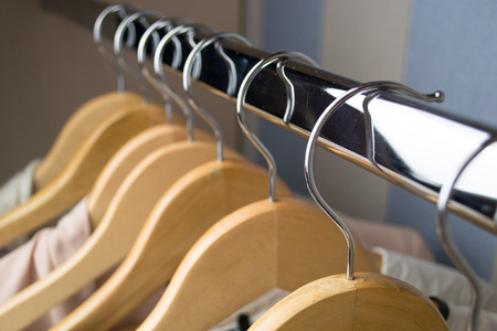 Different clothes on hangers close upの写真素材