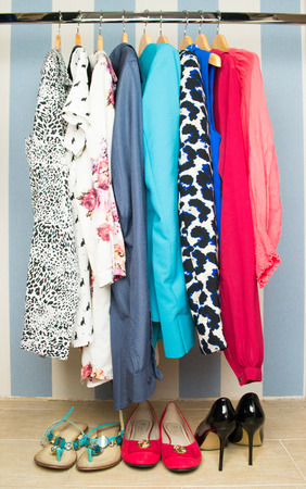 Different clothes on hangers close upの写真素材