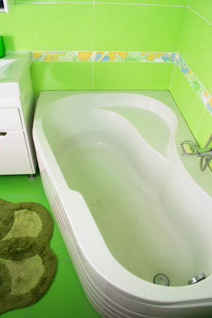 Green bathroom interior. Corner bathの写真素材