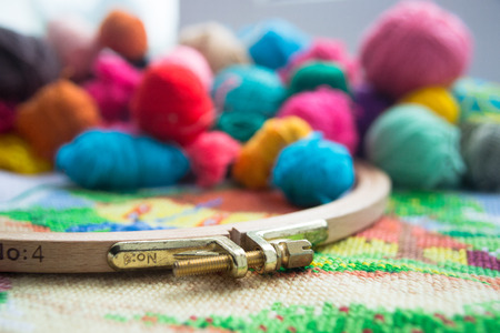 Woolen balls of yarn, tambour and embroidery. Close upの写真素材