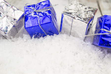 Blue and Silver Christmas gift boxes in a row. White backgroundの写真素材