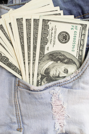 American dollar bills in jeans pocket backgroundの写真素材