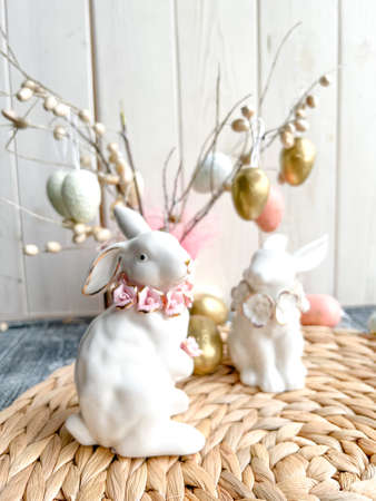 Easter decoration with bunny and eggs on a rustic background.の写真素材