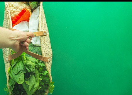 Mixed Vegetables  without plastic backs with copy space on green background