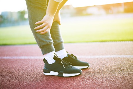 woman is running in the morning in the stadium