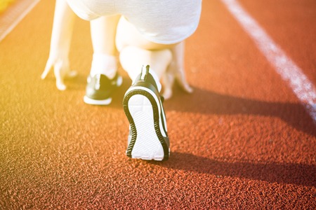 woman is running in the morning in the stadiumの写真素材