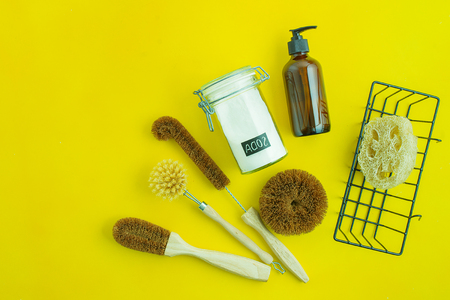 zero waste kit for washing dishers with out plastic on yellow background with copy spaceの写真素材
