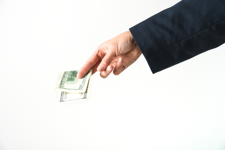hand is holding, giving, counting american dollars. concept of loan, rich lifeの写真素材