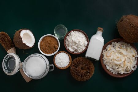 variety of products made from coconut on dark green background with copy spaceの写真素材